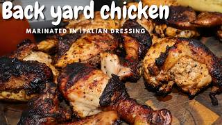 Grilled chicken marinated in Italian salad dressing  backyard style in a Weber kettle grill [upl. by Blessington]