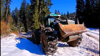 Timberjack 450C in Snowy forest skidding fast [upl. by Yentruoc]