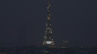 Eiffel Tower sparkles during Olympic opening ceremony  AFP [upl. by Ainimre892]