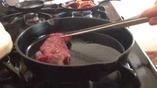 Cooking venison strip in a cast iron skillet [upl. by Joly]