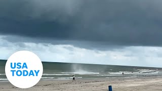 Waterspout forms in Galveston while Texas beachgoers enjoyed waters  USA TODAY Shorts [upl. by Otecina]