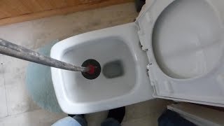 How to clear a blocked WC pan with a drain plunger rod [upl. by Krystalle]