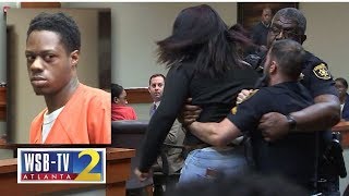 WATCH Murder victims teen daughter lunges at accused killer removed from courtroom  WSBTV [upl. by Enylrac]