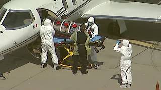 Coronavirus patient arrives at LAX from Aruba in negative pressure isolation chamber I ABC7 [upl. by Gylys16]