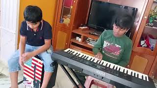 Mahishmati Song playing in piano by AkhilClap Box Playing By Ayaan [upl. by Rutherfurd]