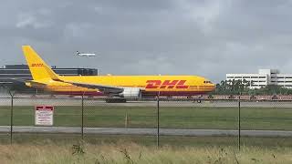 Water spray A DHL Boeing 767316F Er departs Plane spotting at Miami International Airport [upl. by Costanzia]