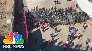 Surge of migrants attempt forced entry at Texas border [upl. by Ameline695]