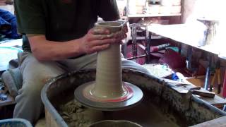 Throwing a couple of simple cylinder form taller pottery vases on the potters wheel [upl. by Armanda959]