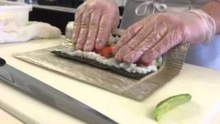 A sushi chefs demonstration of the technique for making a California roll [upl. by Dominga]