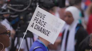 IOC and Paris 2024 chiefs unveil Truce Wall in Olympic Village calling for peace in the world [upl. by Rajewski]