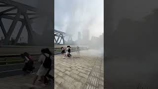 Tide of Qiantang River showers spectators on bridge [upl. by Kcirdlek558]