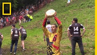 Watch a Downhill CheeseChasing Competition in Britain  National Geographic [upl. by Eliga]