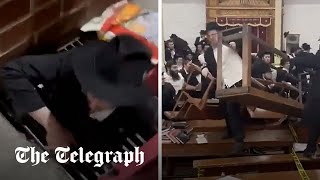 Riot breaks out in New York City synagogue over secret tunnel [upl. by Sualakcin]