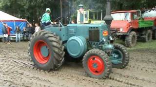 LanzBulldog Tractor pull 4 wheel drive carAuto out of mudbath [upl. by Aibos]