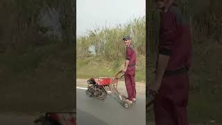 Man Amuses Passerby While Riding Makeshift Engine Powered Wheelbarrow  1194592 [upl. by Jarred]