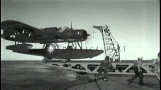 American float plane OS2U catapulted from battleship and bombardment at San FernaHD Stock Footage [upl. by Annaujat]