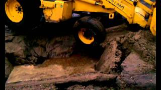 A water main break sends a BackHoe several feet into the ground [upl. by Engle]