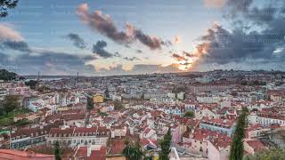 Panorama showing aerial cityscape during sunset from Miradouro da Graca viewpoint in Lisbon city [upl. by Terri]