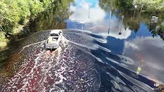 Osteen Maytown Rd Florida drone following a truck driving thru the post Hurricane Ian flooding 106 [upl. by Lebezej]