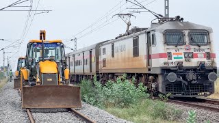 JCB 3DX working on Railway Track to Removes Unwanted Grass and Trees between Two Railway lines [upl. by Ahsram]