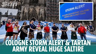 Cologne storm alert closes fan zones amp Tartan Army reveal huge Saltire outside cathedral [upl. by Noirad]