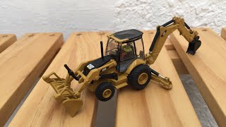 CAT 450E BACKHOE LOADER  DIECAST MASTERS 85263 HO SCALE 187 [upl. by Atem583]