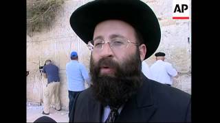 Rabbi clears out prayer notes from Judaisms Western Wall [upl. by Aridan]