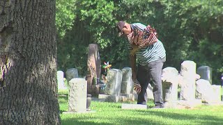 American Legion Dorie E Miller Post 817 place flags on graves at Live Oak Cemetery in Port Arthur [upl. by Lyrradal]