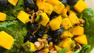 Spinach and mango salad with blueberries and walnuts drizzled with coriander chutney dressing [upl. by Cornelius]