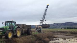 Dragline cleaning effluent pond in northern Southland NZ [upl. by Nodarb682]