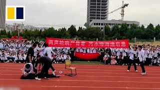 Chinese pupils reenact assassination of Japans Shinzo Abe [upl. by Anauqaj353]