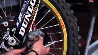 How to Install Front Brake Pads on an Off Road Motorcycle [upl. by Amorete135]