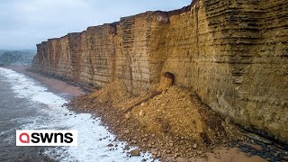 Dramatic footage show huge cliff fall in Dorset UK  SWNS [upl. by Naitsirhk]