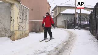 Residents ski through streets following cold snap in Pristina [upl. by Dana]