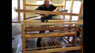 Using the reed to spread warp threads for loom weaving [upl. by Baudelaire408]