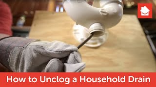 How To Unclog a Sink Using a Drain Snake [upl. by Enautna343]