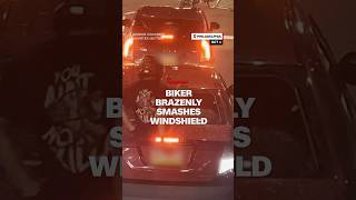 Biker brazenly smashes windshield [upl. by Adniroc]