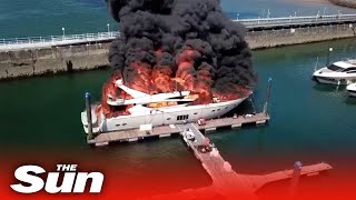 Huge ‘fireball’ rips through £6M super yacht as smoke clears popular beach [upl. by Calandria182]