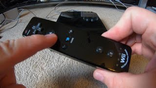 How To Connect a Wiimote Controller With A Nintendo Wii [upl. by Dirrej]