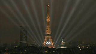 Eiffel Tower illuminates during the Olympic opening ceremony  AFP [upl. by Nerej]