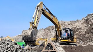 Caterpillar excavator works loading sand into a dump truck  4k [upl. by Aicirtal]