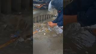 Clean up trash clogged culvert drain under raindrops shorts cleaning satisfying plastic [upl. by Notlok]