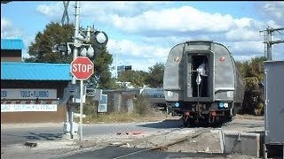 Car Slams Brakes At Crossing While Amtrak Train Is Reversing [upl. by Luther]