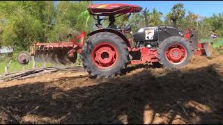 KUBOTA M90 WORKING  Kubota Tractors at Work Mowing Grading Spreading Rock [upl. by Sumaes728]