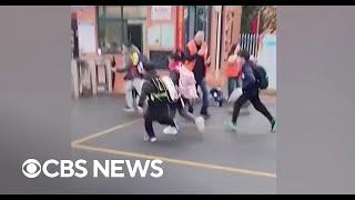 Children run for safety after driver hits crowd outside elementary school in China [upl. by Jariah596]