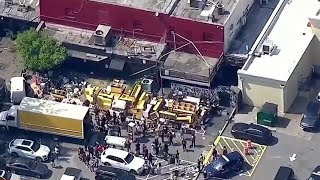 Crowds gather around liquor bottles furniture dumped in front of Red Martini in Buckhead [upl. by Asus]