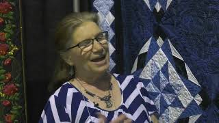 Joanne Lammert Shares Her Celestial Blues Quilt at AQS QuiltWeek  Branson [upl. by Aicella]