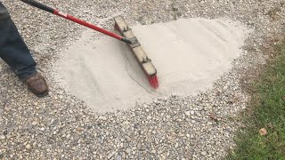 brushing CHEAP concrete onto a gravel driveway adding strength and resilience [upl. by Crescantia281]