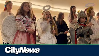 Newcomers from Ukraine celebrate the holidays through traditional carolling [upl. by Silbahc475]