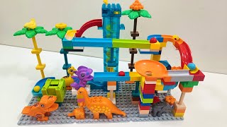 Building a Dinosaur Marble Run with COLORFUL Coasters [upl. by Retsevel677]